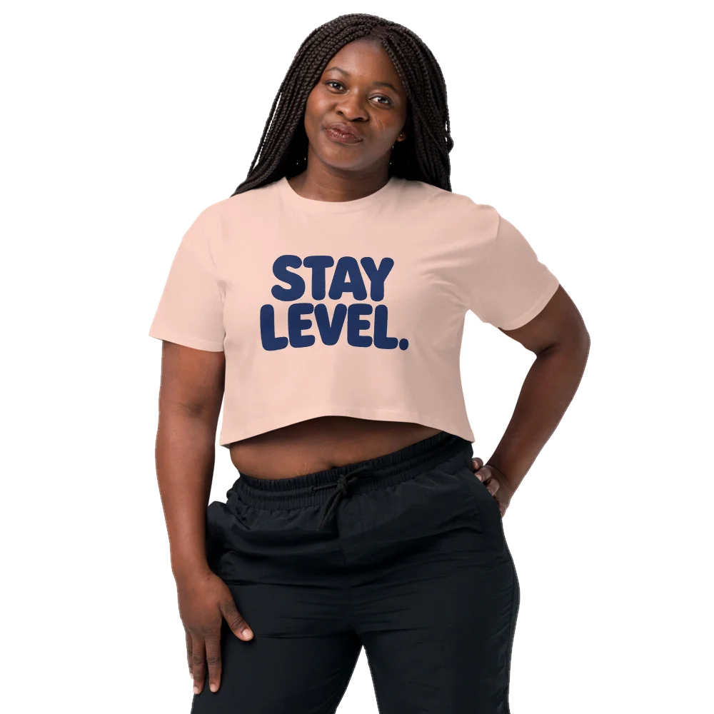 Pale Pink crop top with the Stay Level design, front, on model